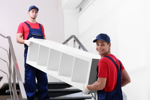 Local movers loading furniture into a van near Balham