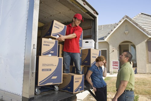 Careful packing and wrapping of household items for a move in Balham