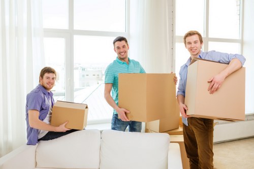 Furniture being carried through a Balham property staircase during removals