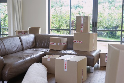 Mover wearing PPE while handling household belongings